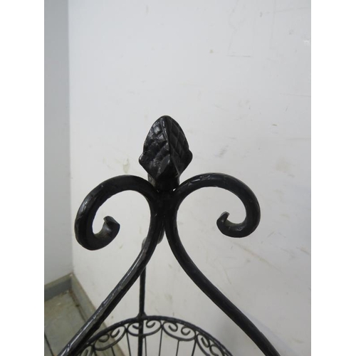 816 - An antique style wrought iron three-tier vegetable/fruit stand, the scrolled cornice with asparagus ... 