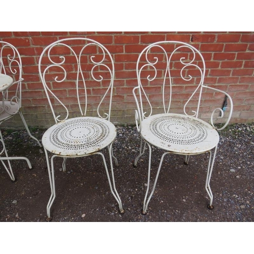 822 - A French wrought iron bistro set painted cream, comprising a circular table and four matching chairs... 