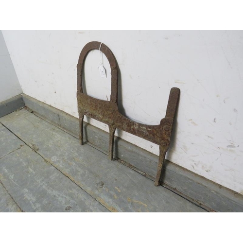 824 - A 18th century or earlier wrought iron boot scraper. 
H36cm D24cm approx.
Condition report: Deep pat... 