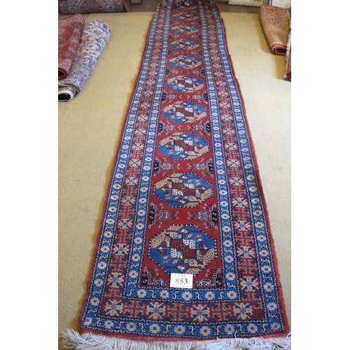 853 - A fine early-mid 20th Century Persian runner with a triple banded border and a repeat central motif.... 