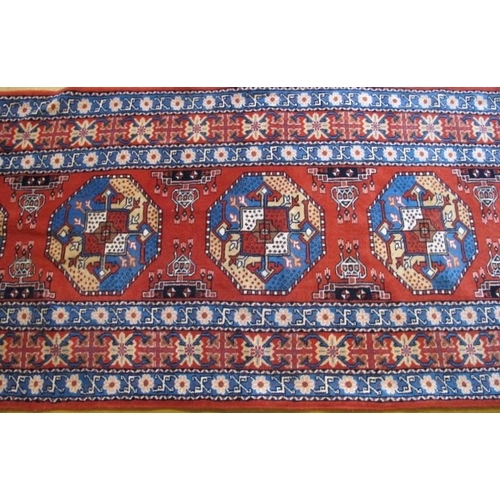 853 - A fine early-mid 20th Century Persian runner with a triple banded border and a repeat central motif.... 