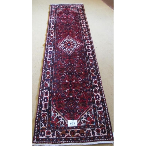 865 - North West Persian Malayer runner, central cream diamond motif on red ground and cream highlighted b... 