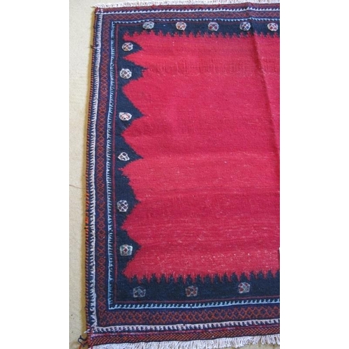 870 - North East Persian meshed Sofreh. A pleasant rug with a plain block red framed by a zig zag border.
... 