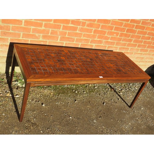 720 - A large Danish mid-century rectangular coffee table, the top with inset burnt orange tiles, on taper... 