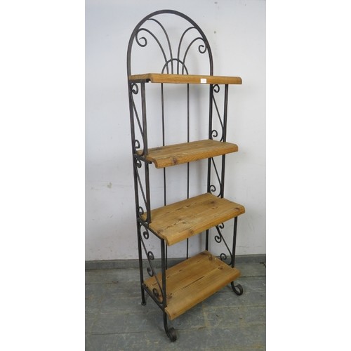 776 - A wrought iron and textured hardwood ‘waterfall’ shelving unit of four open shelves, on scrolled sup... 