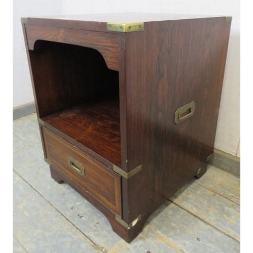 712 - A 20th Century rosewood campaign style bedside cabinet with open shelf above a single drawer.  H61cm... 