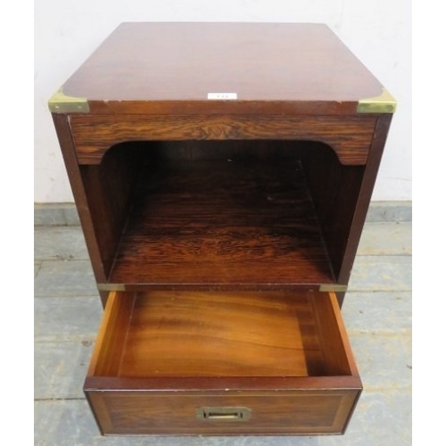 712 - A 20th Century rosewood campaign style bedside cabinet with open shelf above a single drawer.  H61cm... 