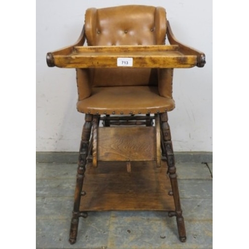 713 - C1900 Child's metamorphic high chair with a tan leatherette upholstered seat over turned legs.  H93c... 