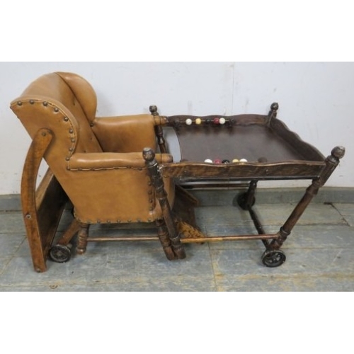 713 - C1900 Child's metamorphic high chair with a tan leatherette upholstered seat over turned legs.  H93c... 