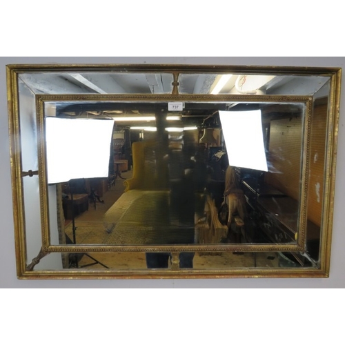 737 - A gilt Regency mirror with five pieces of mirror separated with carved mouldings.  
Condition report... 