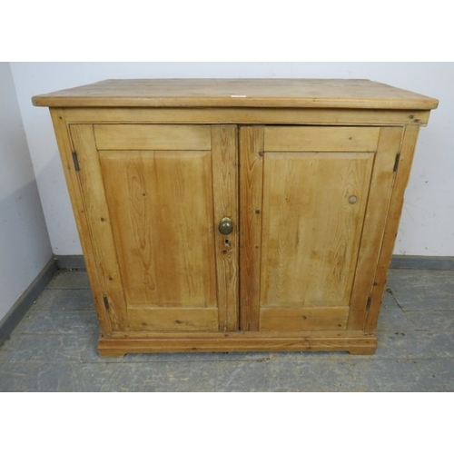 759 - A 19th Century pine two door cupboard with a single shelf inside and a brass handle.  H93cm x W108cm... 