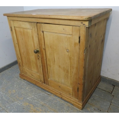 759 - A 19th Century pine two door cupboard with a single shelf inside and a brass handle.  H93cm x W108cm... 