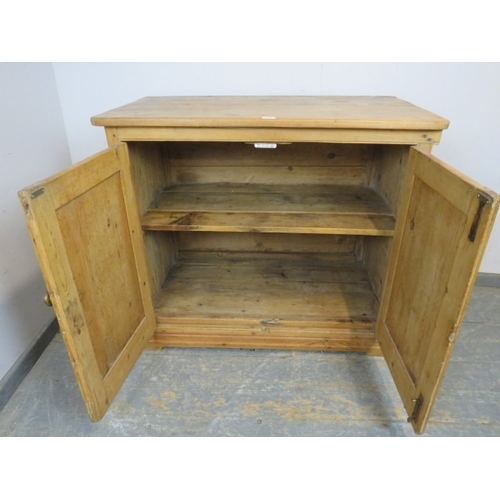 759 - A 19th Century pine two door cupboard with a single shelf inside and a brass handle.  H93cm x W108cm... 
