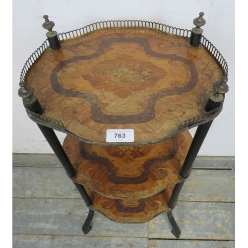 763 - A three tier French Regency period inlaid marquetry whatnot with a brass gallery rail to top and fin... 
