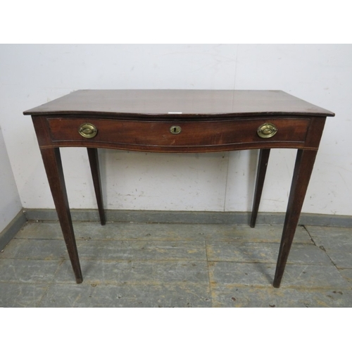 794 - A 19th Century mahogany bow fronted side table with a single frieze drawer.  Brass oval handles and ... 