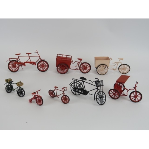 180 - A group of vintage enamelled metal bicycle and tricycle models. A ‘Dolls House Emporium Collector’s ... 