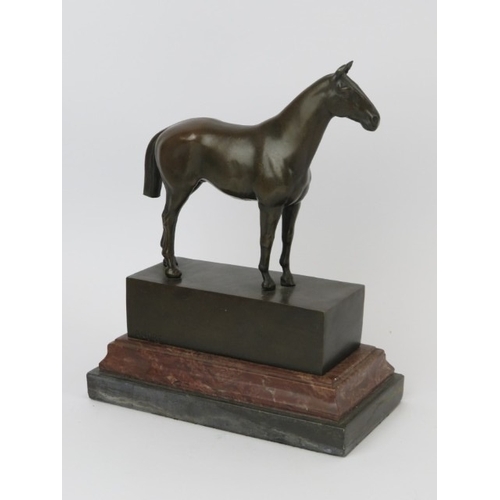 24 - A bronze horse statue, signed ‘Andre’, 20th century. Mounted on a red and black marble base. 21.7 cm... 