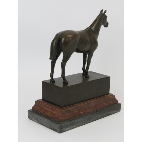 24 - A bronze horse statue, signed ‘Andre’, 20th century. Mounted on a red and black marble base. 21.7 cm... 