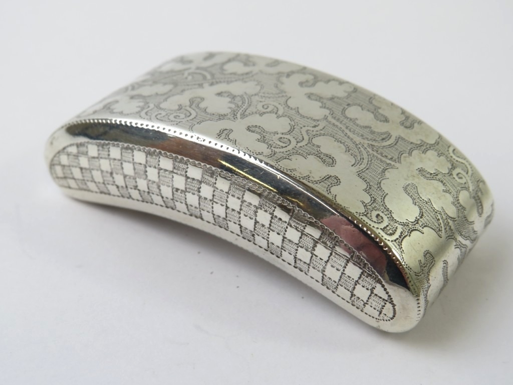 A George III curved silver snuff box with foliate and chequer engraved ...