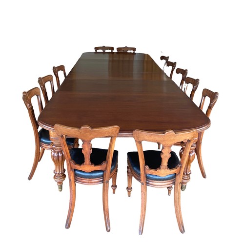 122 - A Most Impressive Vict Mah Dining Room Table with 4 Extra Leaves , standing on 4 Stunning Fluted and... 