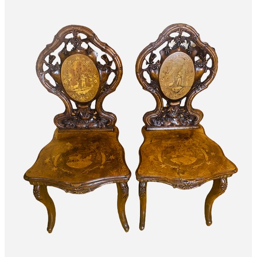 205 - Rare Pair of 19C Inlaid Tyrolen Walnut Highly Carved Hall Chairs