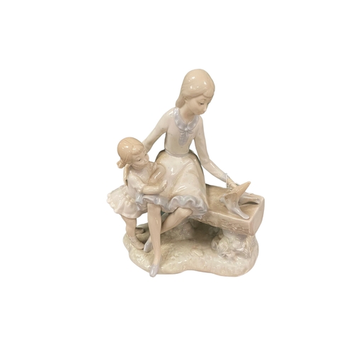 5 - Nao Figure of 2 Girls on Bench with Doves
20cm W x 22cm H