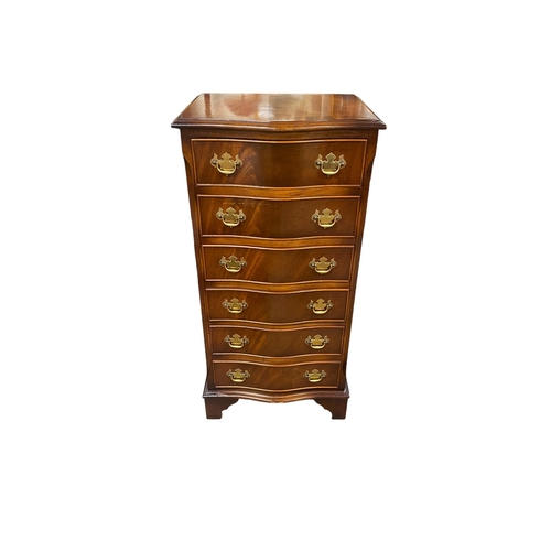 33 - Tall Mahogany Serpentine Slimline Chest 
50cm W 40cm D 100cm H