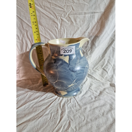 209 - Blue painted jug