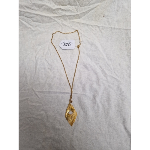 370 - Gold coloured chain with unusual pendant