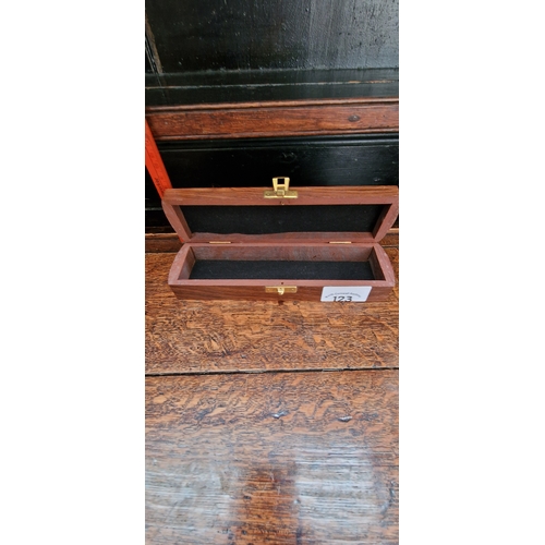 123 - Wood and brass inlaid pen/jewellery case