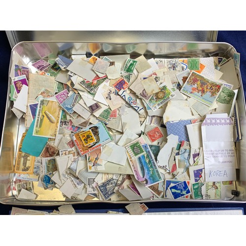 2 - Tin of International Stamps with Collectors Book