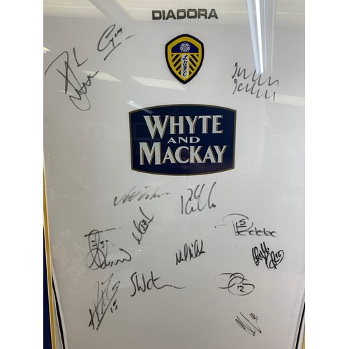 35 - Lucas Redebe Leeds United shirt with hand signed autographs inc. many of the team