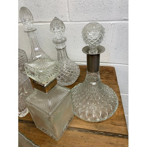 186 - Collection of 10 Vintage decanters of varying age