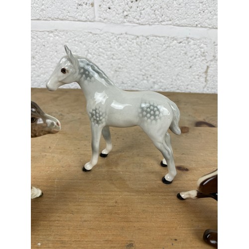 95 - Three Beswick Figurines, Dapple Grey Foal, Sitting Foal 915 & Pony