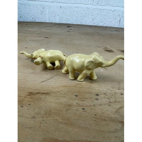 209 - Two Vintage Porcelain Imitation Ivory Elephants 1 A/F