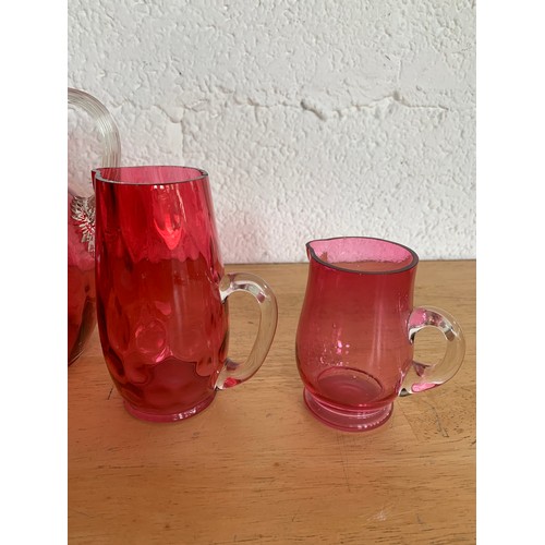 151 - Collection of Cranberry Glass Jugs