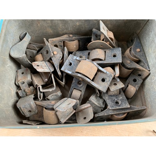 195 - Tin of Antique Roller Castors, Pulleys etc.