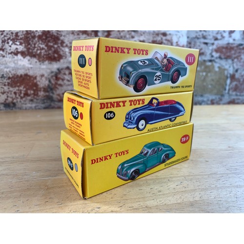 141 - Three Mint Dinky Toys Boxed - Triumph TR2 Sports, Austin Atlantic Convertible, Studebaker Coupe