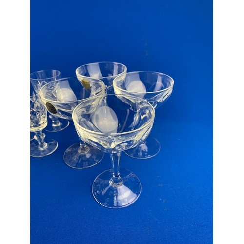 147 - Four Crystal d'Arques Coupe Glasses and Four Cut Wine Glasses