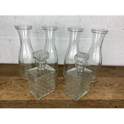 386 - 4 Ikea Carafes and 2 Decanters