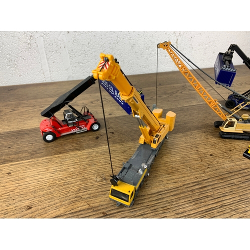 61 - Various Die Cast Cranes, Excavators and Plant by Sika, Oxford and Editions Atlas inc. Liebherr