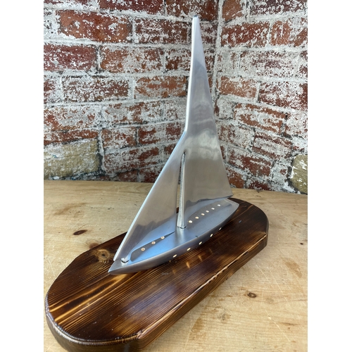 345 - Machined Aluminium Sailing Boat Lamp On Carved Wooden Plinth.