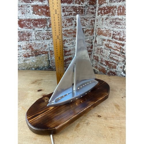 345 - Machined Aluminium Sailing Boat Lamp On Carved Wooden Plinth.