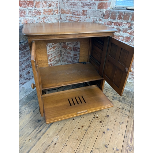 438 - Ercol Golden Dawn TV Cabinet on wheels with retractable doors