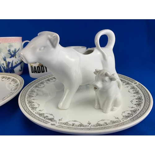 309 - Wedgwood China Metalised Plates, Cow Themed Milk Jugs etc.