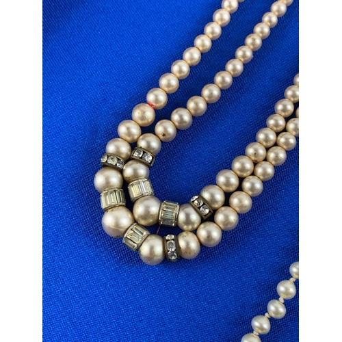 32 - Two Vintage Faux Pearl Necklaces. One with Silver Clasp