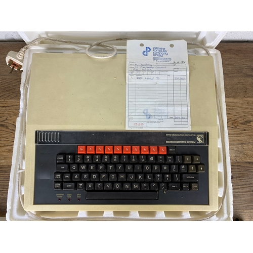 329 - BBC Microcomputer System - Partly Boxed with original bill of sale, tapes and accessories