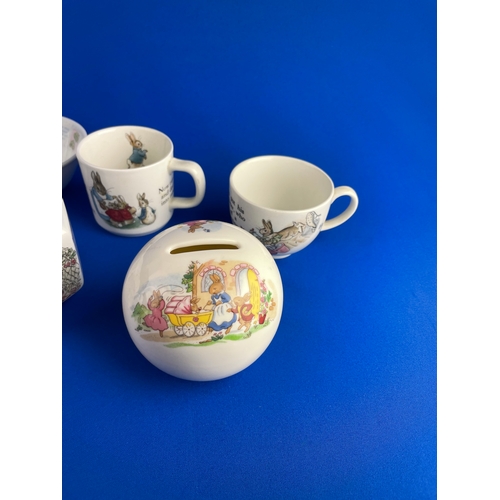 261 - Wedgwood & Royal Doulton Peter Rabbit Items Inc. Money Boxes & Cups