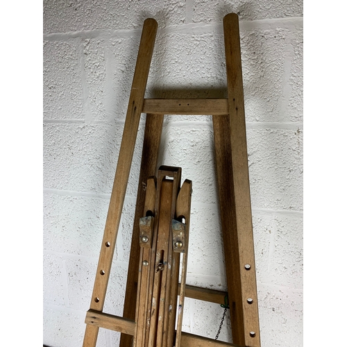 385 - A Trio of Wooden Artist Easels.  One Fixed and Two Adjustable