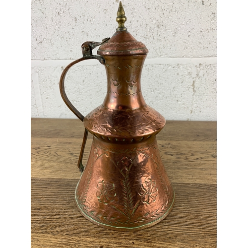 283 - Arts and Crafts Relief Decorated Copper and Brass Jug